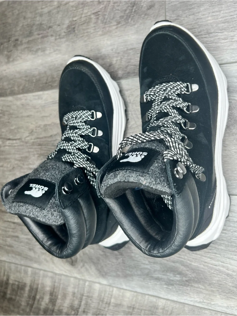 Sorel Black Lace-Up Winter Boots with White Accents